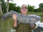 Mike Wright with a red river channel catfish, legendary